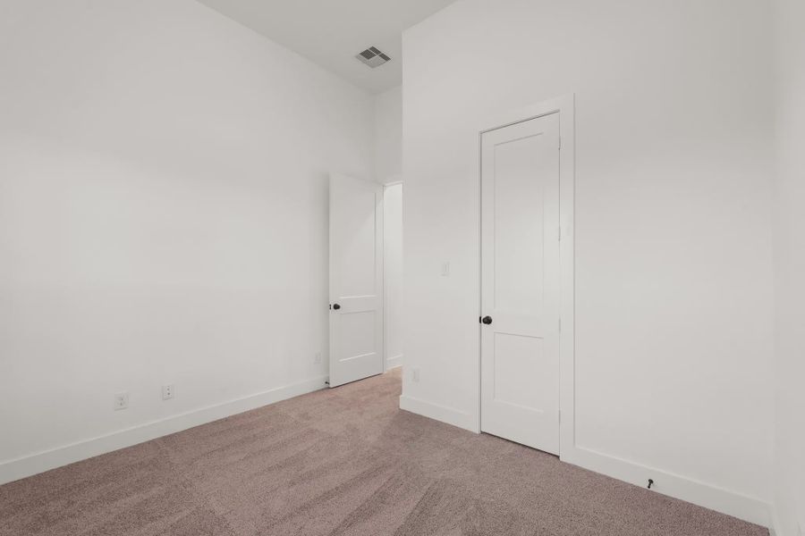 Representative unfurnished interior of a home built from the Palmer by Chesmar Homes in Riceland Alley Loads, Mont Belvieu (Image 34).