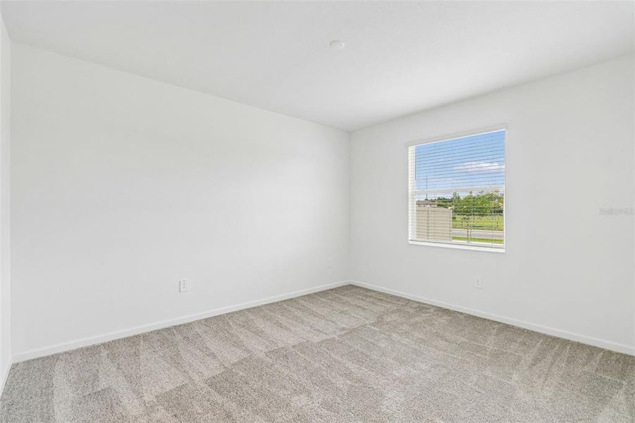 Spacious, unfurnished interior of a new home in Peace Creek Reserve, Winter Haven (Image 30).