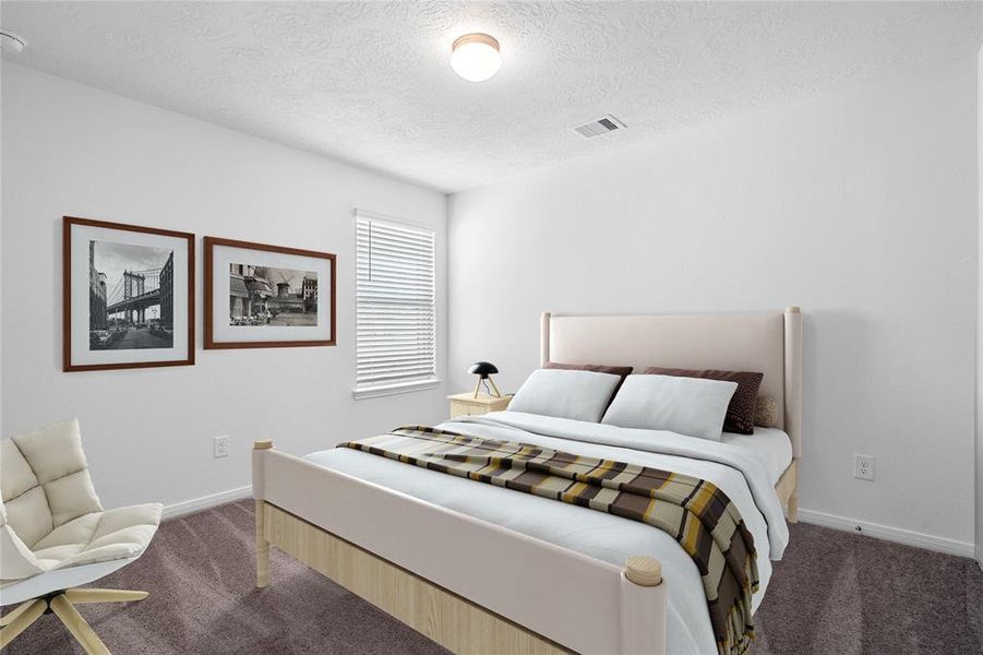 Secondary bedroom features plush carpet, custom paint, lighting, ample closet space, and a large window with privacy blinds.