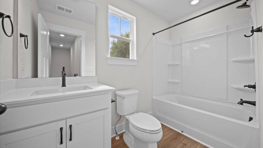 Accomplished full bath designed with both comfort and sophistication in mind