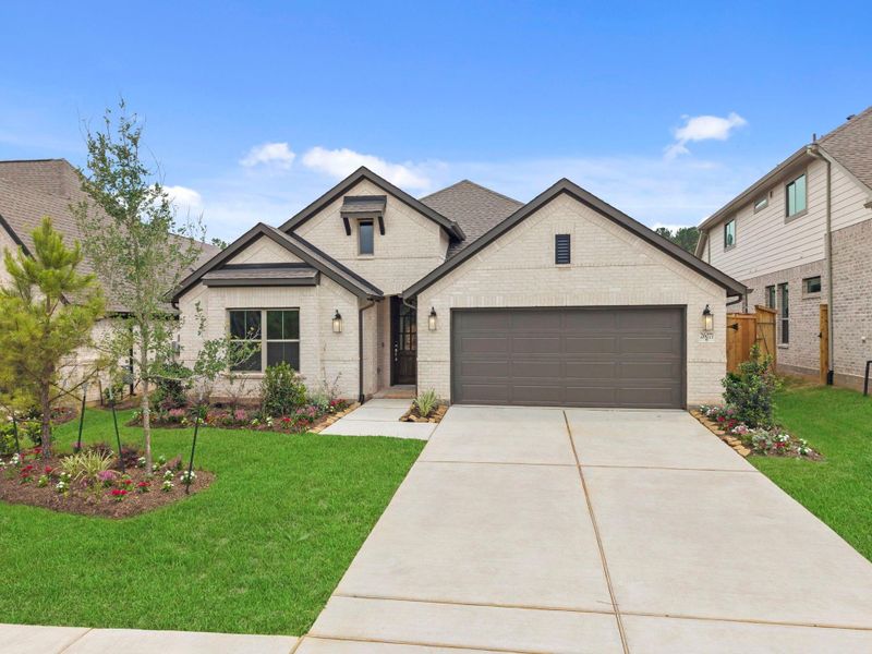 Front exterior of a new home in Wildtree, Magnolia, TX, highlighting curb appeal (Image 22).
