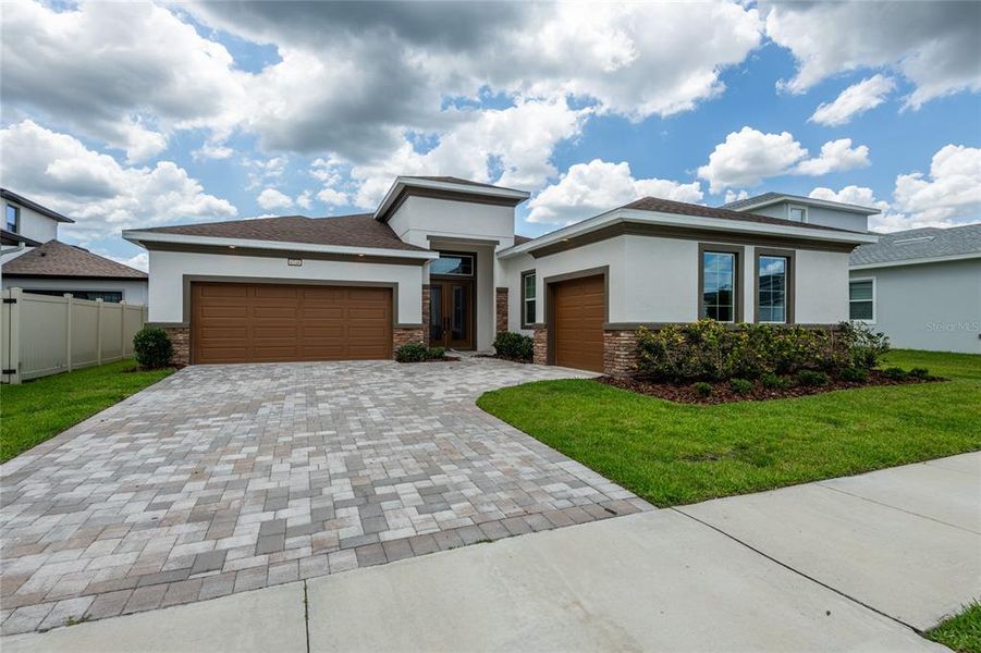 Front exterior of a new home in , Wesley Chapel, FL, highlighting curb appeal (Image 27).