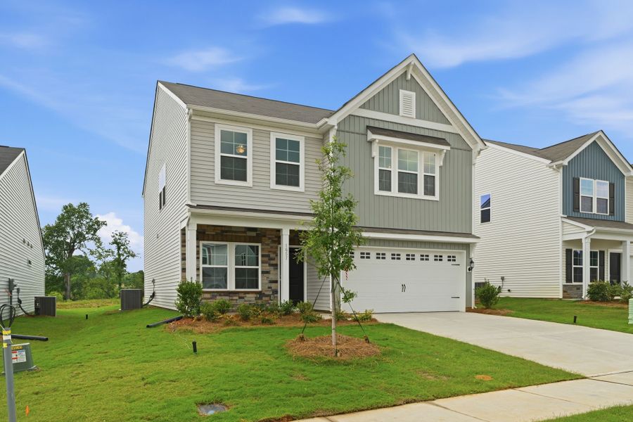 Front exterior of a new home in Piper Creek, Newton, NC, highlighting curb appeal (Image 2). Front exterior of a new home in Piper Creek, Newton, NC, highlighting curb appeal (Image 2).