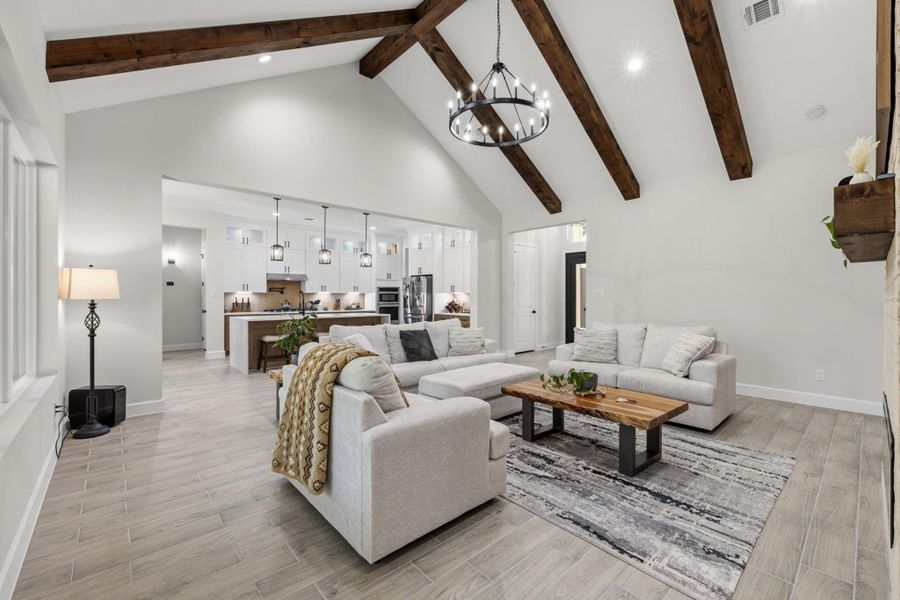 LIVING ROOM II -The main living area flows seamlessly into the kitchen, creating an open-concept layout designed for effortless everyday living and entertaining.
