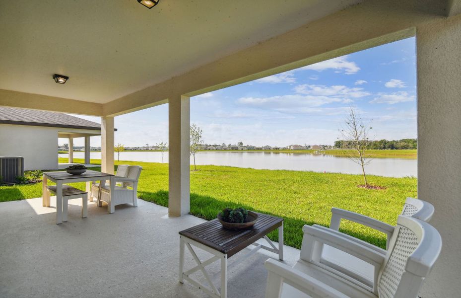 Exterior details and patio area of a home in Oakfield Lakes, Parrish (Image 2).