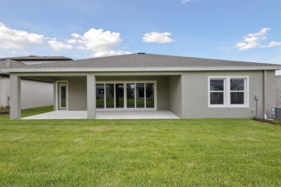 Front exterior of a new home in Waterset, Apollo Beach, FL, highlighting curb appeal (Image 18).
