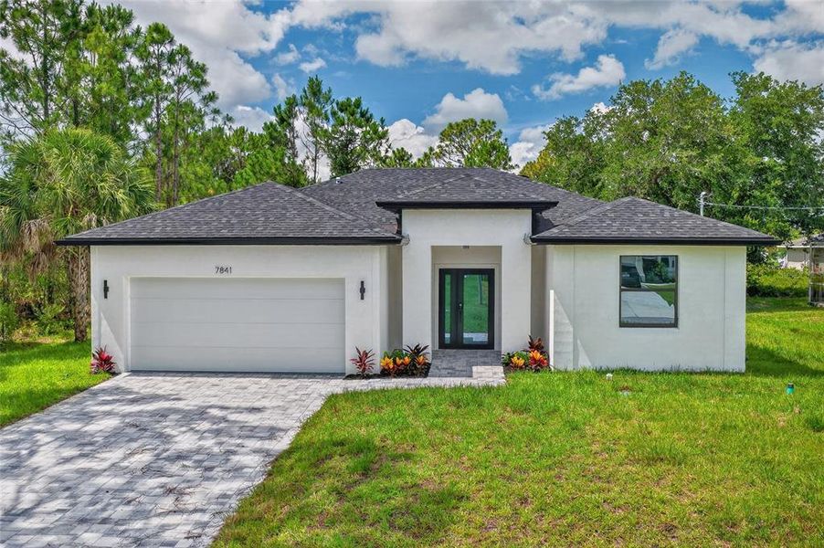 Front exterior of a new home in , North Port, FL, highlighting curb appeal (Image 25). Front exterior of a new home in , North Port, FL, highlighting curb appeal (Image 25).