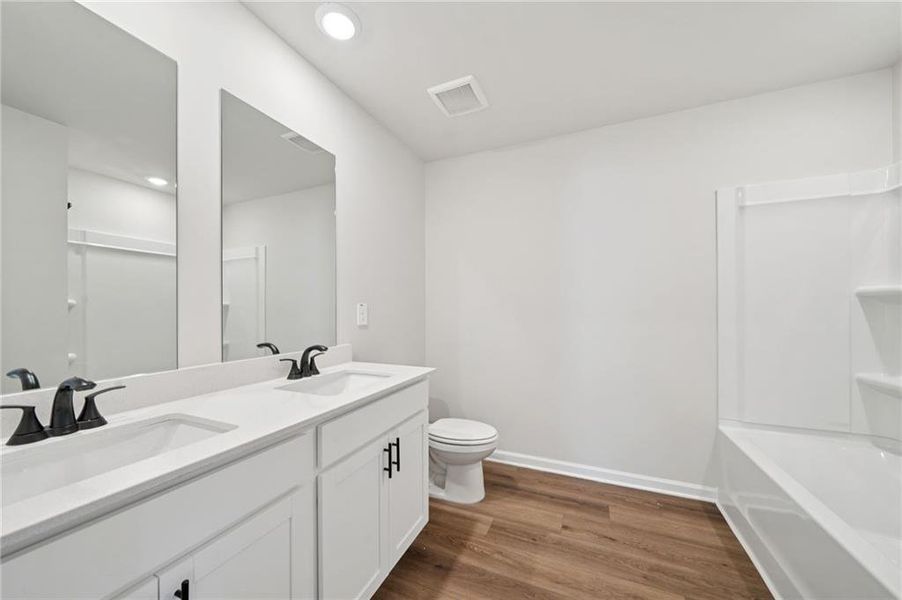 Furnished interior view inside a new home in Vines at Mill Creek - Estate Series, Braselton (Image 11).