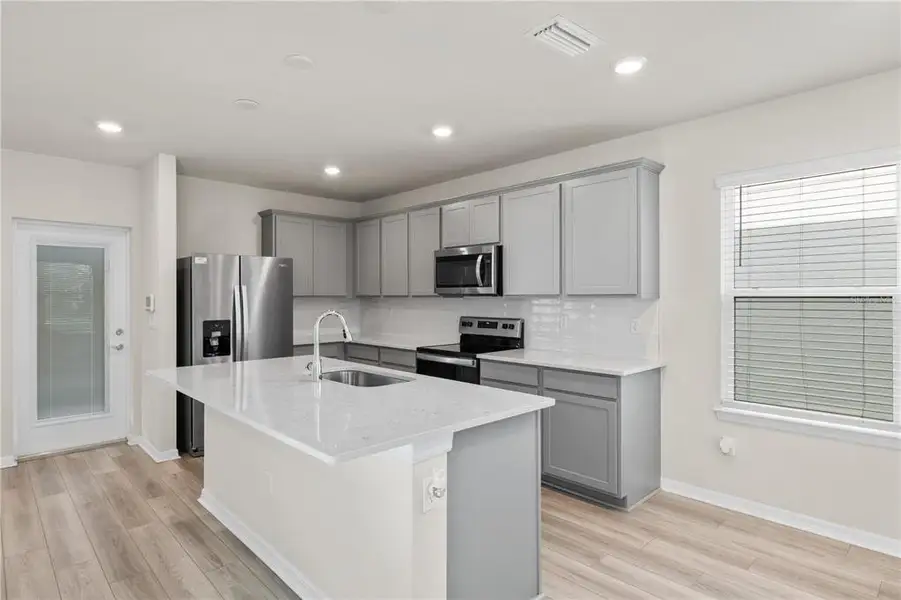 Furnished interior view inside a new home in EverBe, Orlando (Image 13).