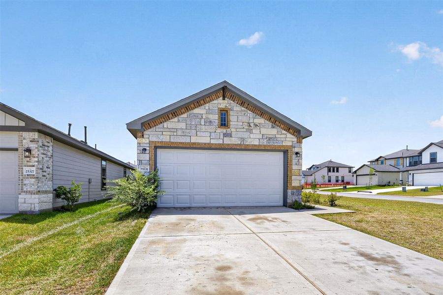 Front exterior of a new home in , Montgomery, TX, highlighting curb appeal (Image 23).