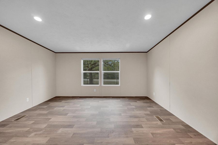 Unfurnished room featuring light wood-type flooring, ornamental molding, and recessed lighting