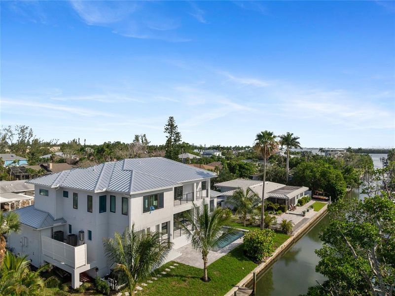 Front exterior of a new home in , Longboat Key, FL, highlighting curb appeal (Image 38). Front exterior of a new home in , Longboat Key, FL, highlighting curb appeal (Image 38).