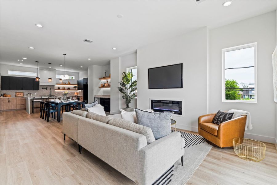 Symmetrical design meets functional living, with a clear view across the entire second floor from kitchen to living room. Symmetrical design meets functional living, with a clear view across the entire second floor from kitchen to living room.