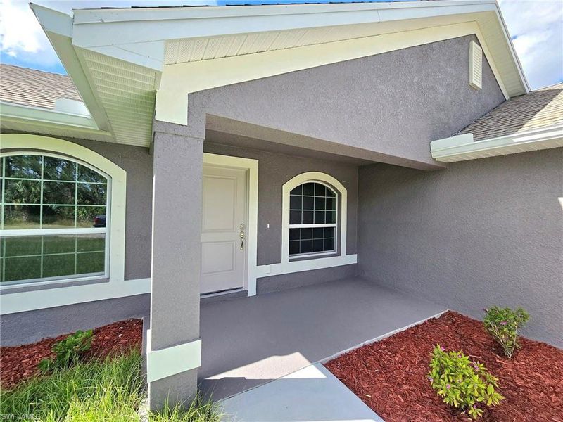 Front exterior of a new home in Lehigh Acres, Lehigh Acres, FL, highlighting curb appeal (Image 13).