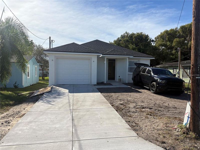 Front exterior of a new home in , Lakeland, FL, highlighting curb appeal (Image 1).