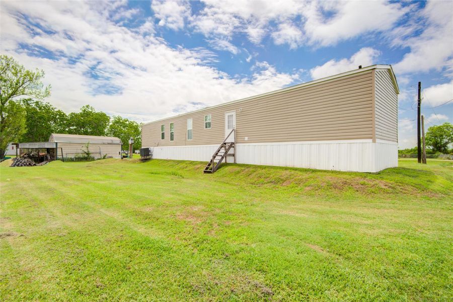 Exterior details and patio area of a home in , Brazoria (Image 26).