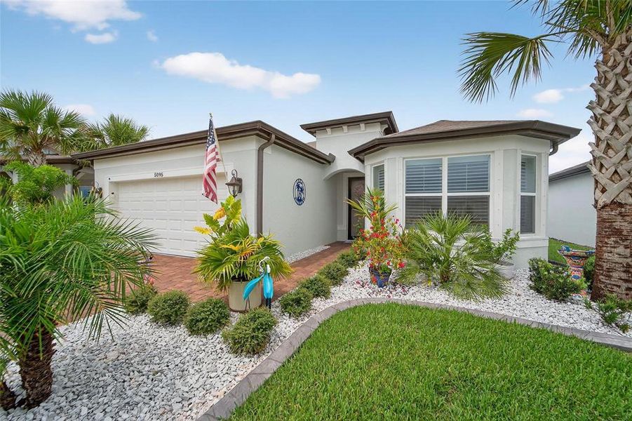 Front exterior of a new home in , Land O' Lakes, FL, highlighting curb appeal (Image 20).