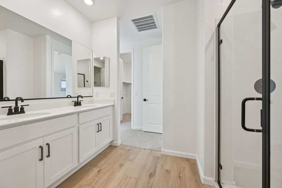 Primary bath. Finishes and options may vary by community.