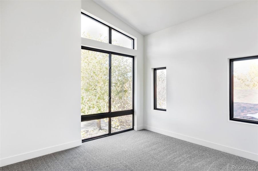 2nd of 3 upper bedrooms, high ceilings, lots of natural light