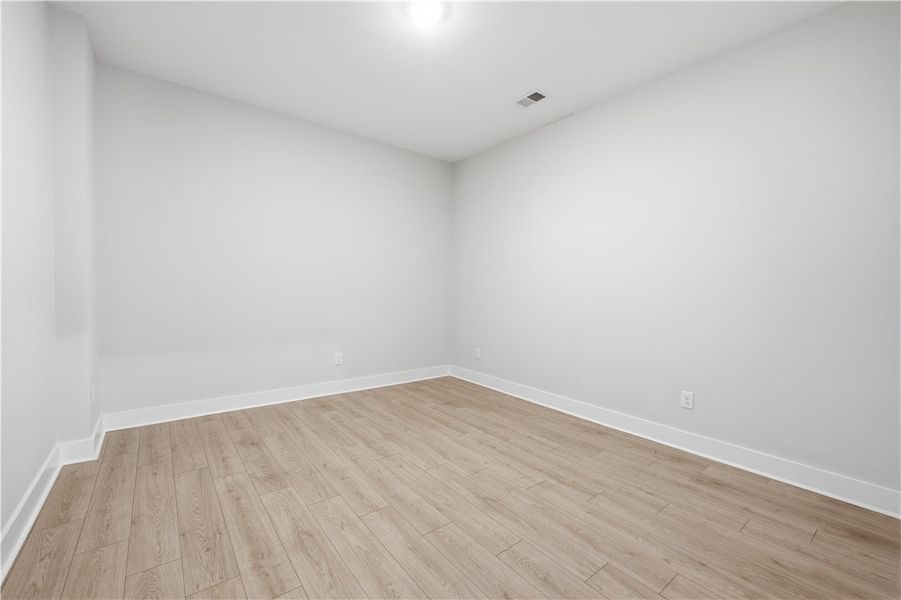 Smooth plaster walls and clean-lined wood flooring