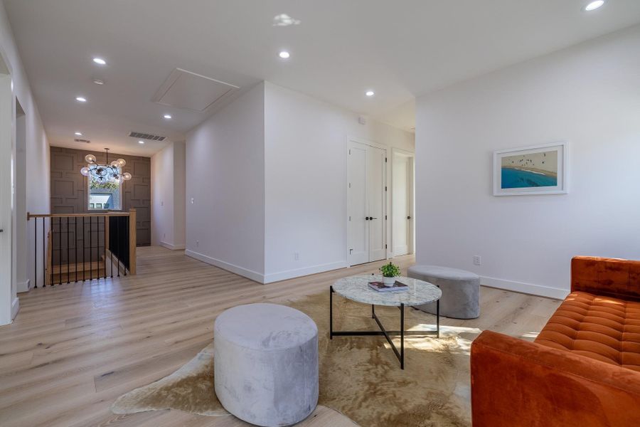 Alternate view of upstairs living area showcasing generous proportions and natural light.