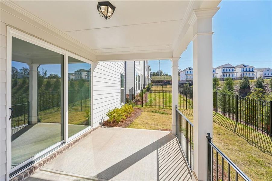 Exterior details and patio area of a home in Palisades Single Family, Cumming (Image 30).