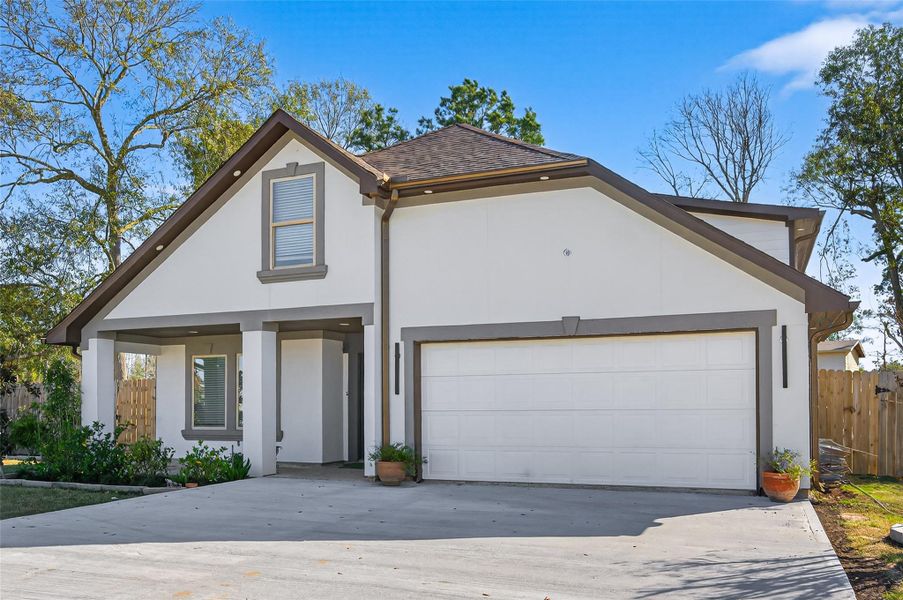 Front exterior of a new home in , Conroe, TX, highlighting curb appeal (Image 24). Front exterior of a new home in , Conroe, TX, highlighting curb appeal (Image 24).
