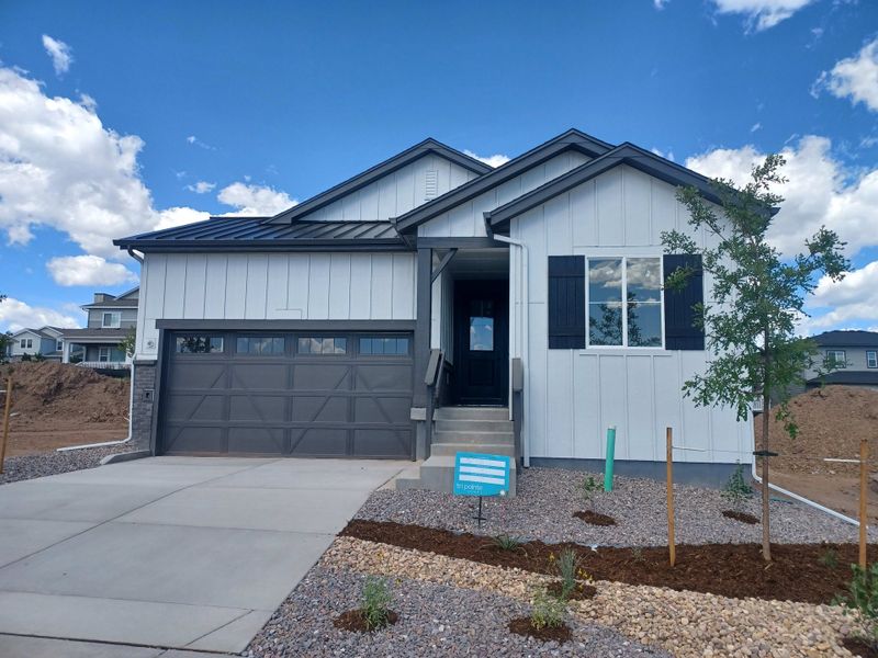 Front exterior of a new home in Sterling Ranch, Littleton, CO, highlighting curb appeal (Image 1). Front exterior of a new home in Sterling Ranch, Littleton, CO, highlighting curb appeal (Image 1).