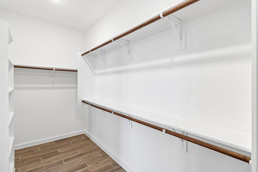 Primary walk-in closet Primary walk-in closet