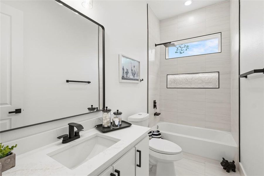 Full bath with shower / washtub combination, toilet, and vanity