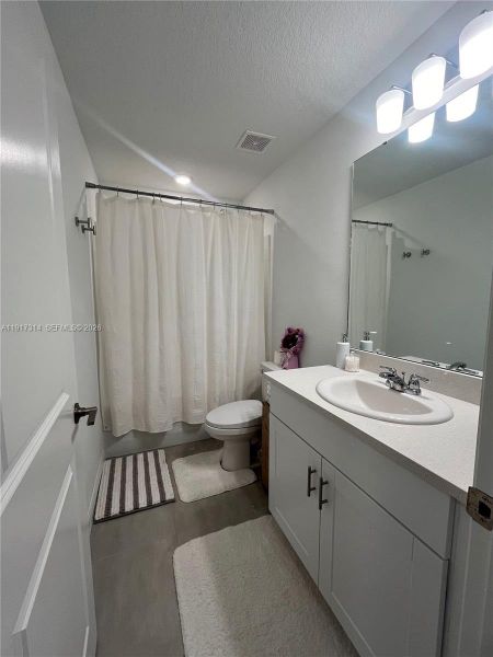 Furnished interior view inside a new home in The Townhomes at Bellalago, Kissimmee (Image 13).