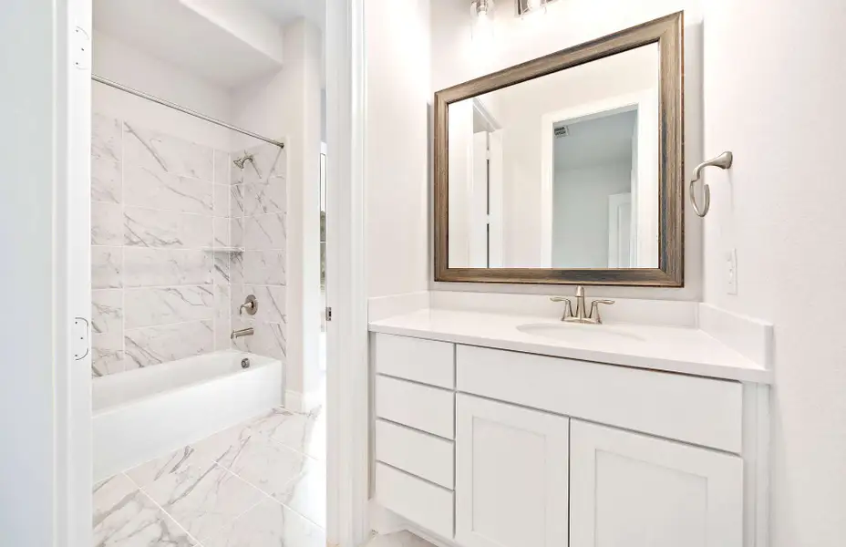 Representative furnished interior of a home built from the 3068 by Ravenna Homes in The Woodlands Hills 65′, Willis (Image 30).