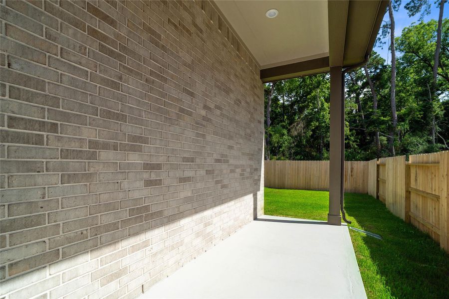 Step outside to the covered rear patio, the perfect extension of your indoor living space for year-round enjoyment. Step outside to the covered rear patio, the perfect extension of your indoor living space for year-round enjoyment.