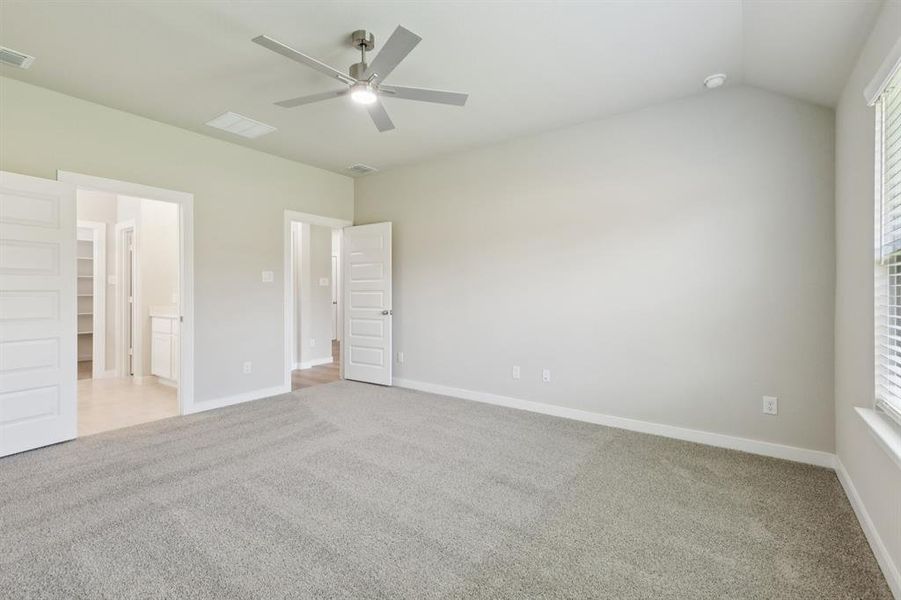 Primary Suite in the Heisman home plan by Trophy Signature Homes – REPRESENTATIVE PHOTO