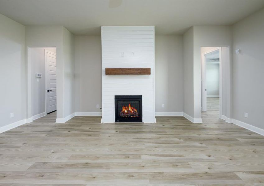 The fire place has beautiful shiplap details.