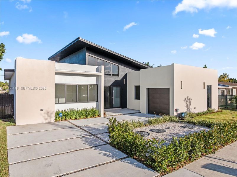 Front exterior of a new home in , Miami, FL, highlighting curb appeal (Image 1). Front exterior of a new home in , Miami, FL, highlighting curb appeal (Image 1).