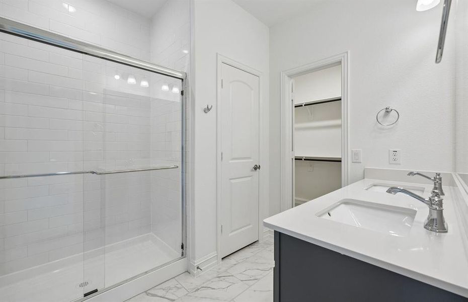 Private primary bathroom with walk in closet Private primary bathroom with walk in closet