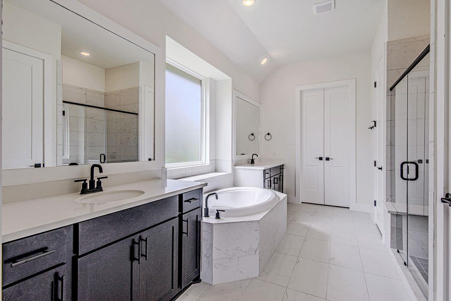 Designed for convenience, the spacious primary bath offers plenty of storage and room to start and end your day with ease Designed for convenience, the spacious primary bath offers plenty of storage and room to start and end your day with ease