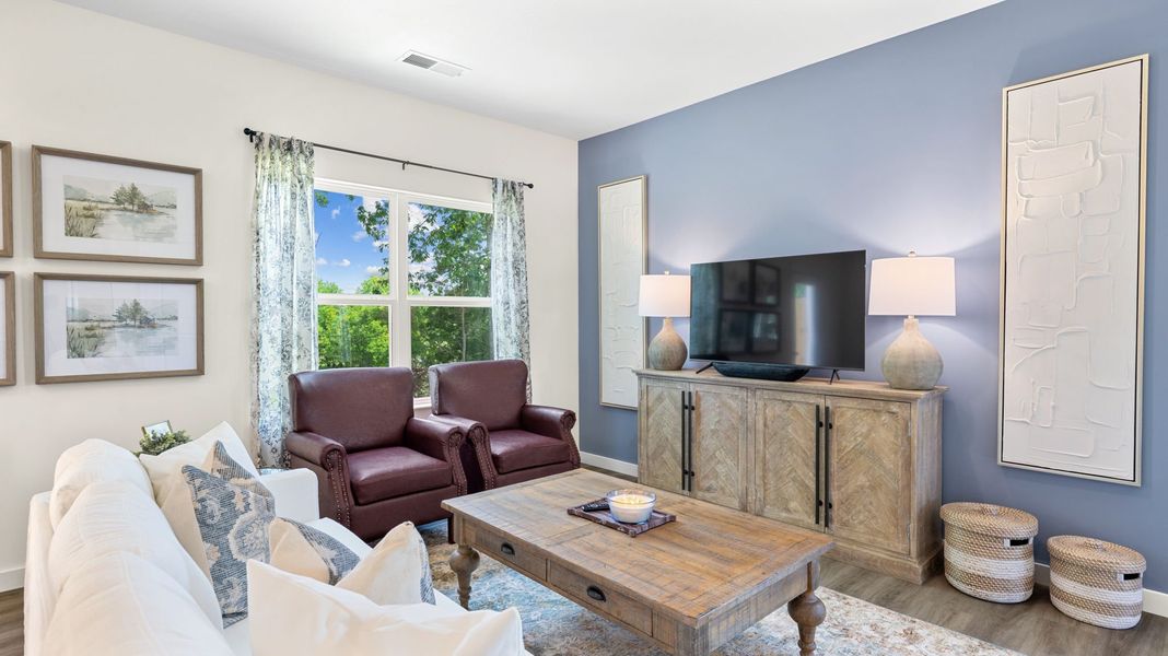 Representative furnished interior of a home built from the Mitchell Townhome by D.R. Horton in Belcourt Landing, Cleveland (Image 13).