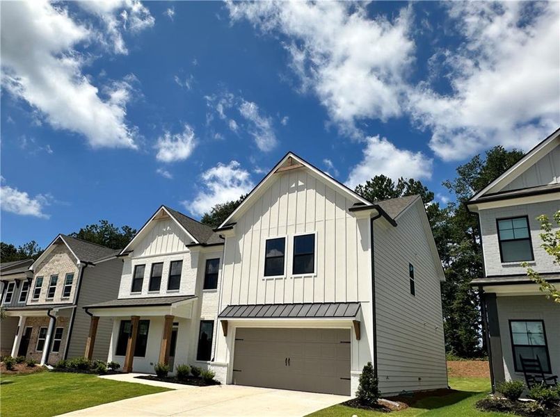 Front exterior of a new home in Summerlin, Winder, GA, highlighting curb appeal (Image 27).