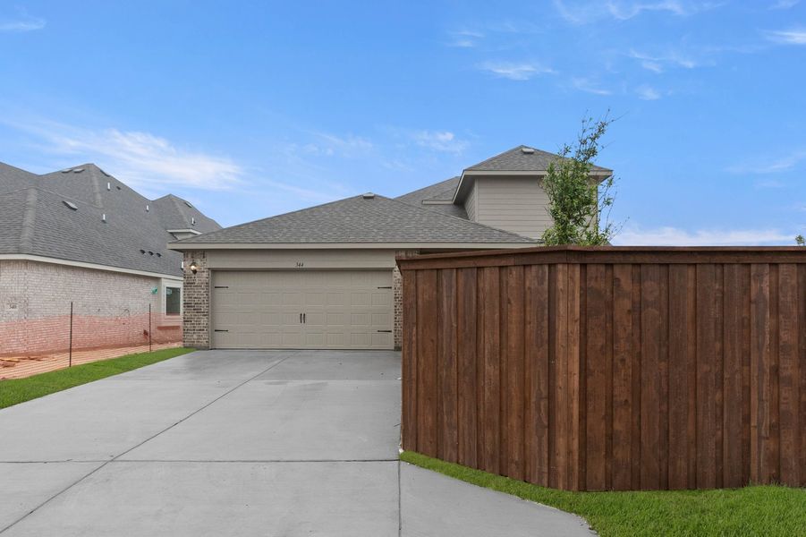 Front exterior of a new home in Redden Farms, Midlothian, TX, highlighting curb appeal (Image 27). Front exterior of a new home in Redden Farms, Midlothian, TX, highlighting curb appeal (Image 27).