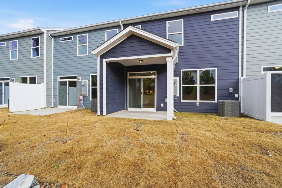 Exterior details and patio area of a home in Harrisburg Village Townhomes, Harrisburg (Image 32).