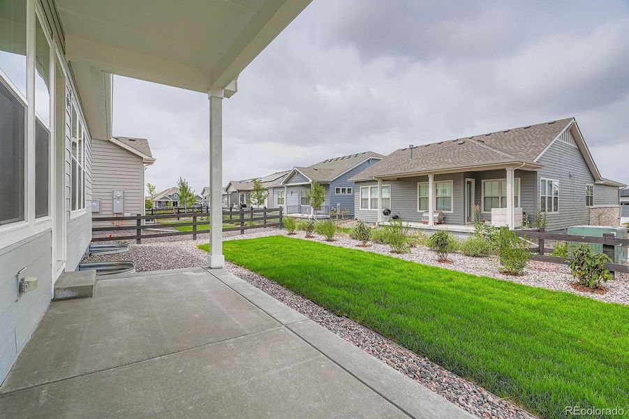 Front exterior of a new home in Hilltop 55+ at Inspiration 55s, Aurora, CO, highlighting curb appeal (Image 20).