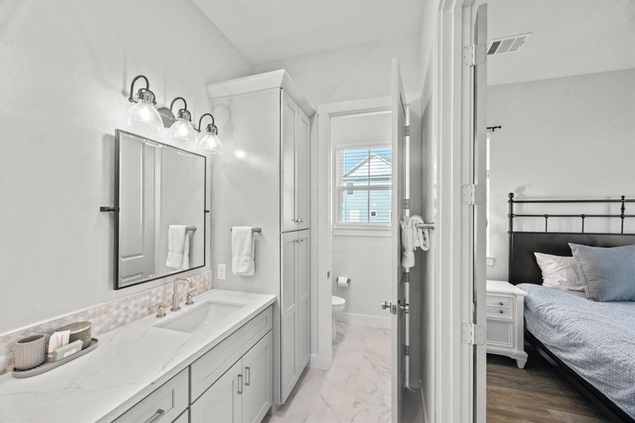 A private water closet offers added privacy and convenience, enhancing the functionality of the ensuite.