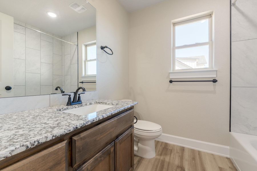 Bathroom featuring vanity and light wood-style flooring
