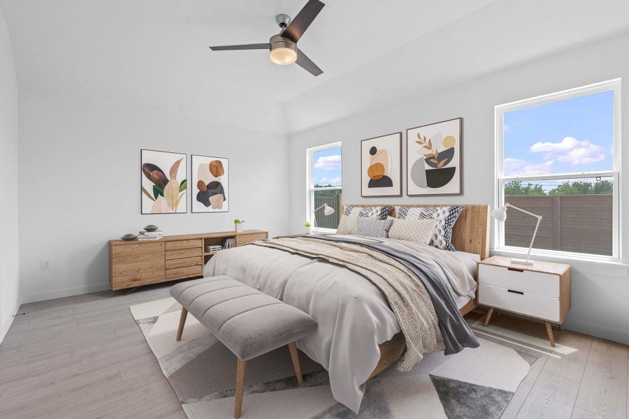 Bedroom with light wood-style flooring and a ceiling fan Bedroom with light wood-style flooring and a ceiling fan