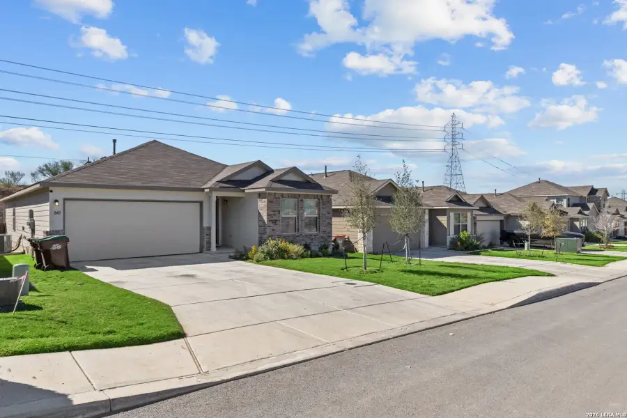 Front exterior of a new home in Agave, San Antonio, TX, highlighting curb appeal (Image 17).