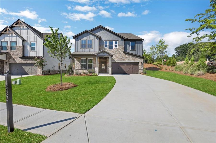 Front exterior of a new home in The Paddocks at Doc Hughes, Buford, GA, highlighting curb appeal (Image 24).
