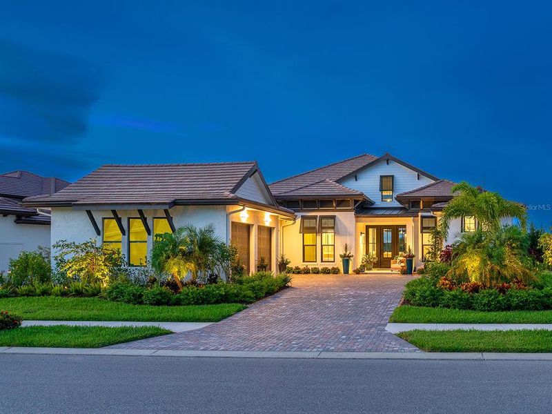 Front exterior of a new home in Wild Blue at Waterside, Sarasota, FL, highlighting curb appeal (Image 2). Front exterior of a new home in Wild Blue at Waterside, Sarasota, FL, highlighting curb appeal (Image 2).