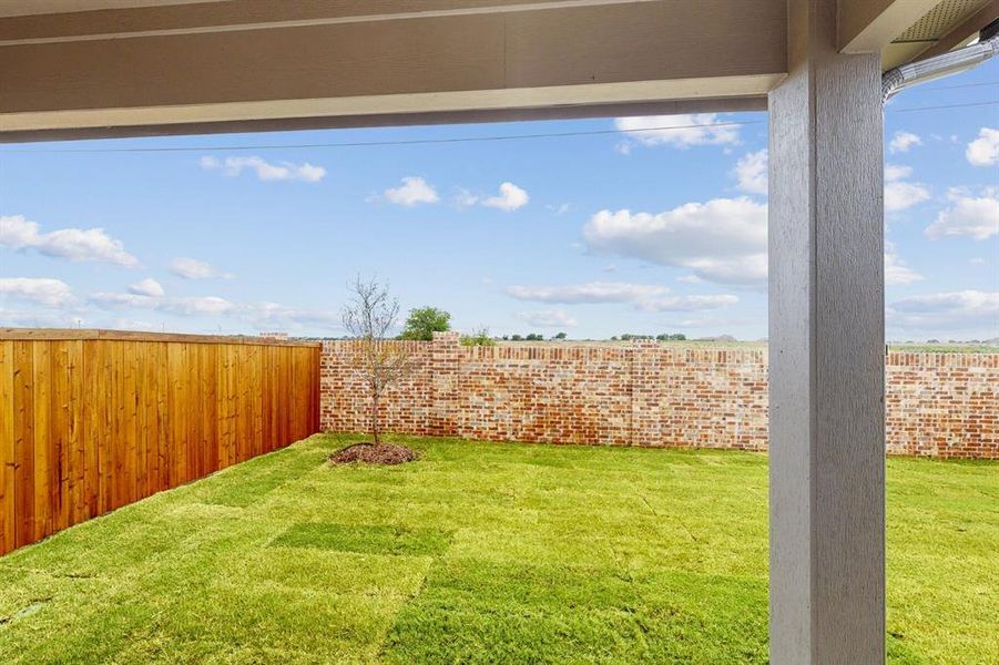 Exterior details and patio area of a home in Mobberly Farms, Pilot Point (Image 3). Exterior details and patio area of a home in Mobberly Farms, Pilot Point (Image 3).